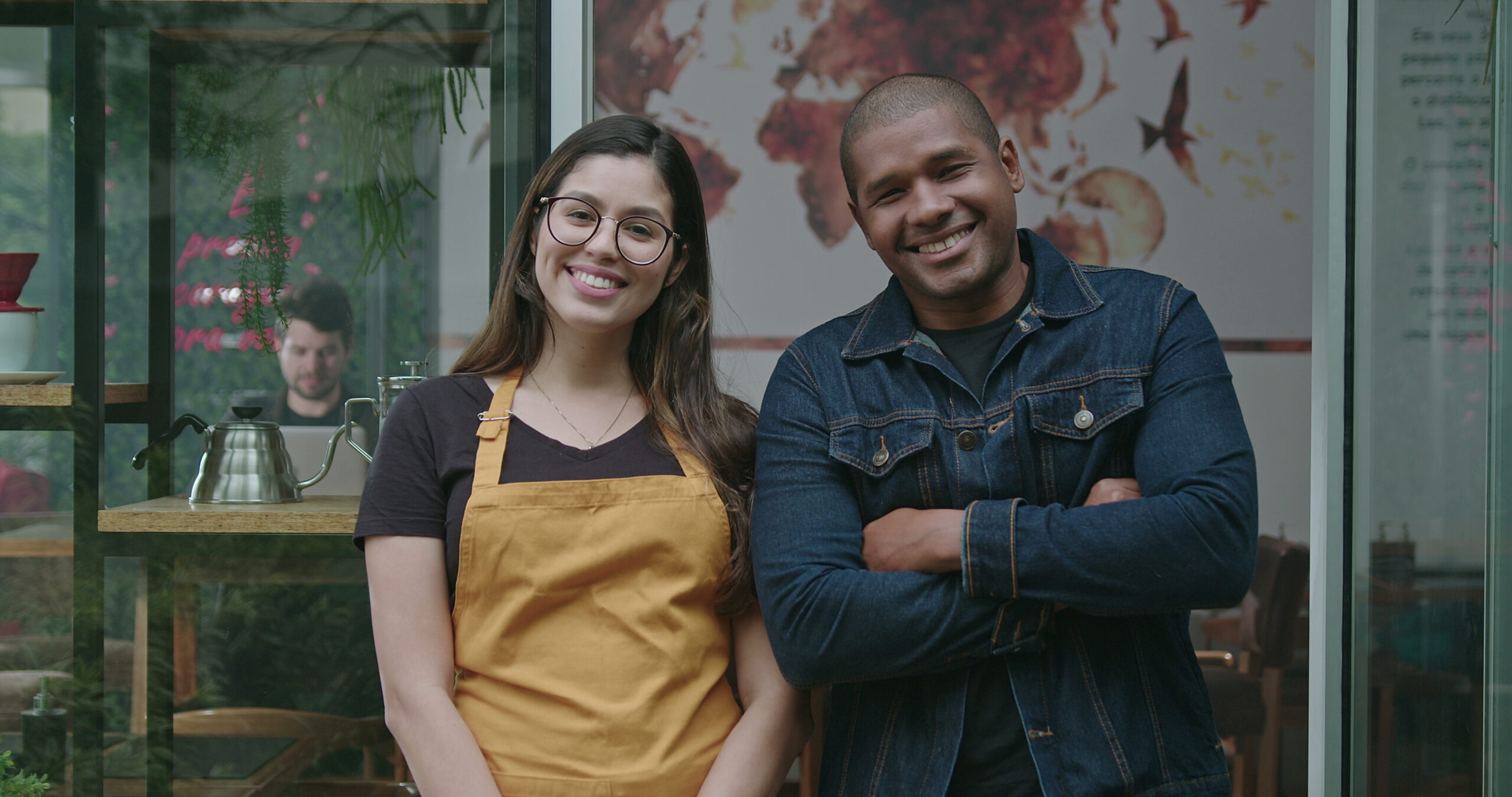 Two Migrapreneurs In A Cafe Setting, Symbolising The Welcoming Nature Of Australia