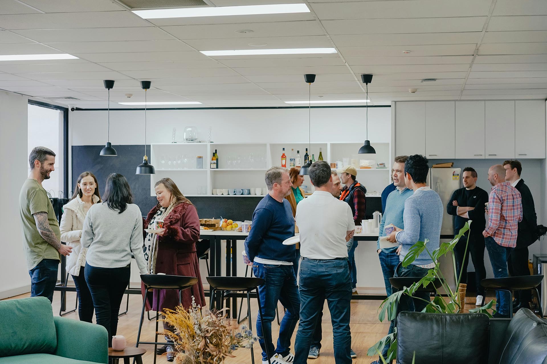 The Newcomer’s Roadmap To Australia A Group Of People At The Networking Event Discussing New Projects
